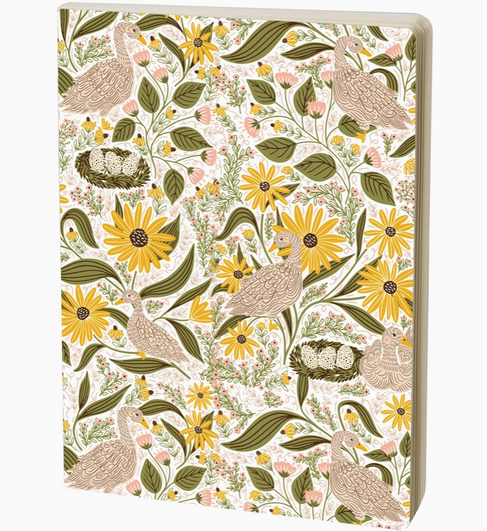 A notebook featuring a detailed William Morris-style floral and bird pattern with yellow flowers, green leaves, and brown birds on an off-white background.
