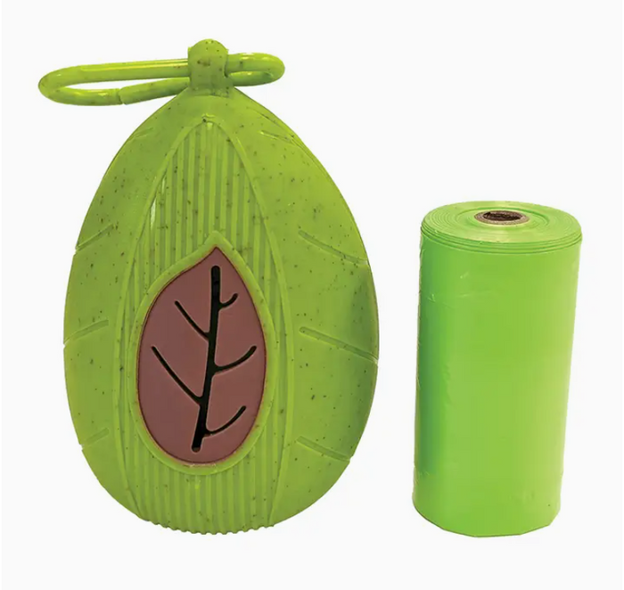 Green leaf-shaped container with a brown leaf design on a white background