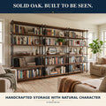 Solid oak bookcase with galvanized pipe frame highlighting natural oak grain and handcrafted farmhouse style
