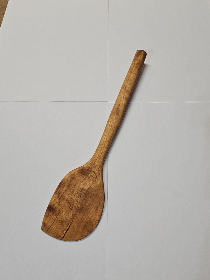 wooden spatula on white background
