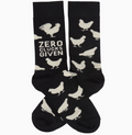 Black socks with white chicken illustrations and 'Zero Clucks Given' text on a white background